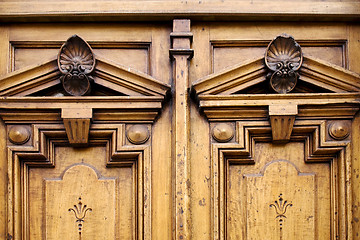 Image showing the top of a closed double wood  door 