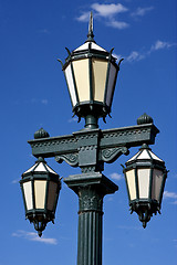 Image showing old green street lamp and clouds 