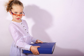 Image showing Basic school child with file in the hand and pencil behind the ear