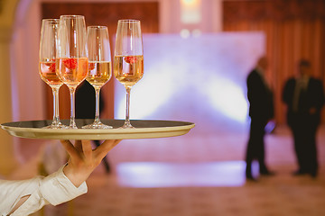 Image showing Waiter serving champagne on a tray