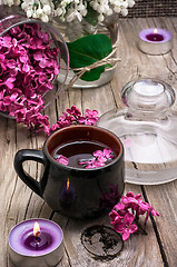 Image showing fragrant tea and a branch of lilac