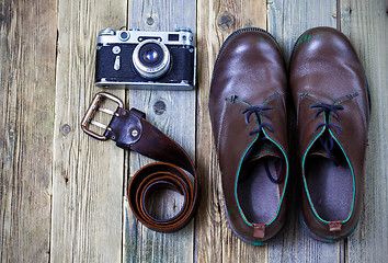 Image showing sturdy boots, leather belt, and rangefinder camera