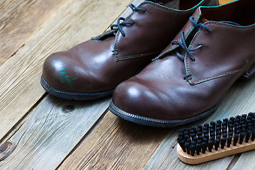 Image showing vintage boots, brush and shoe polish