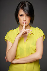 Image showing Woman with finger on lips