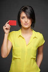 Image showing Confident woman showing blank credit card