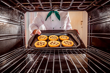 Image showing Chef cooking in the oven.