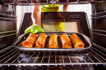 Image showing Cooking in the oven at home.