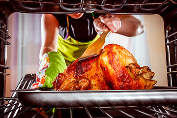 Image showing Cooking chicken in the oven at home.