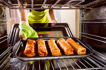 Image showing Cooking in the oven at home.