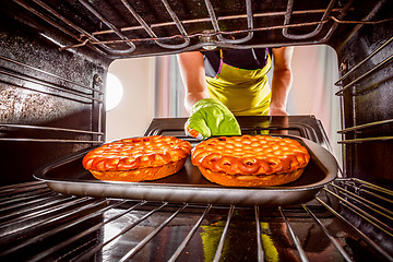 Image showing Cooking in the oven at home.