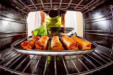 Image showing Cooking in the oven at home.