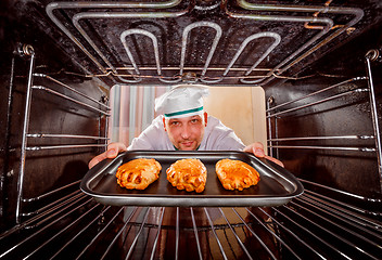 Image showing Chef cooking in the oven.