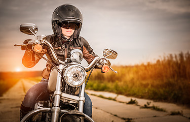 Image showing Biker girl on a motorcycle