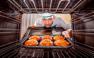 Image showing Chef cooking in the oven.