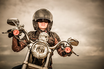 Image showing Biker girl on a motorcycle