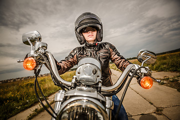 Image showing Biker girl on a motorcycle