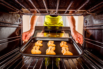 Image showing Baking Gingerbread man in the oven