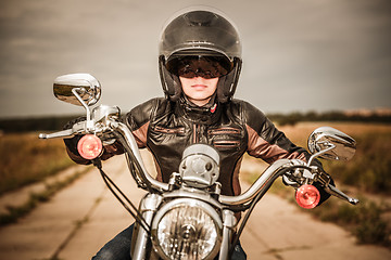 Image showing Biker girl on a motorcycle