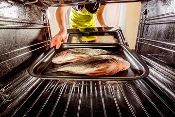 Image showing Cooking Dorado fish in the oven.