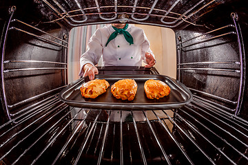 Image showing Chef cooking in the oven.