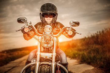 Image showing Biker girl on a motorcycle