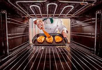 Image showing Chef cooking in the oven.