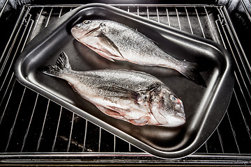 Image showing Dorado fish in the oven.