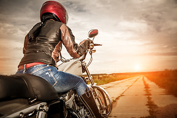 Image showing Biker girl on a motorcycle