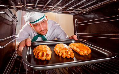 Image showing Chef cooking in the oven.