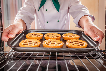 Image showing Chef cooking in the oven.