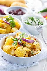 Image showing Baked potatoes with chutney and sour cream