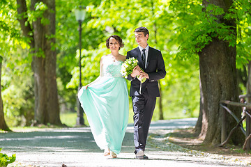 Image showing Wedding couple walking in park.