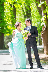 Image showing Wedding couple walking in park.