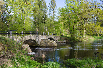 Image showing Ancient bridge at small river