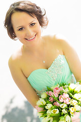 Image showing Happy bride with wedding bouquet.