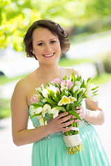 Image showing Happy bride with wedding bouquet.