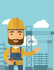 Image showing Man standing infront of construction crane tower.