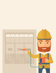 Image showing Electrician repairing an electrical panel