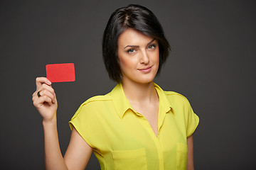 Image showing Confident woman showing blank credit card