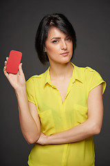 Image showing Confident woman showing blank credit card