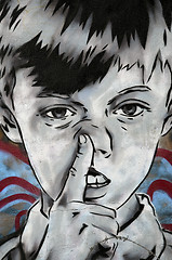 Image showing Boy picking his nose