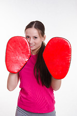 Image showing Athlete with boxing paws in the hands of