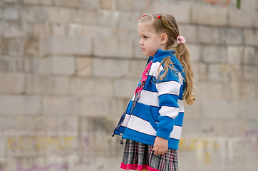 Image showing Girl in a sweater looking to the left