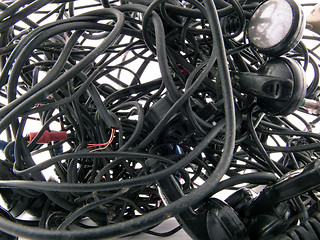 Image showing Interlacing of the broken off wires of old headphones. backgroun