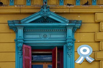 Image showing  old blue yellow little terrace red venetian blind and roof 