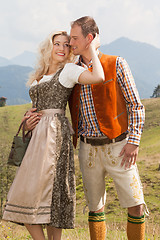 Image showing Young romantic couple in traditional Bavarian costumes