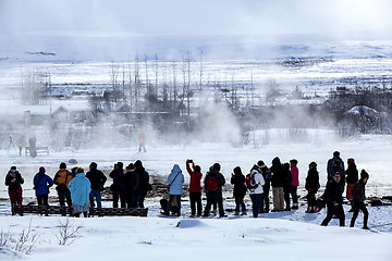 Image showing Visitors watching the eruption of a geyser in Iceland