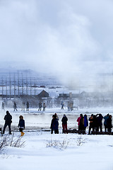 Image showing Visitors watching the eruption of a geyser in Iceland