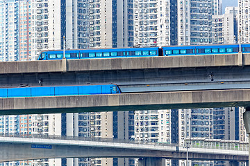Image showing high speed train on bridge in hong kong downtown city