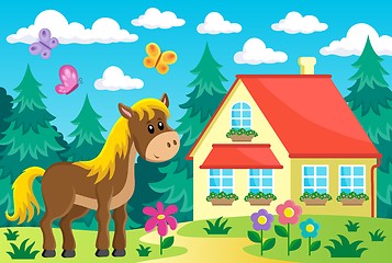 Image showing Horse in garden near house